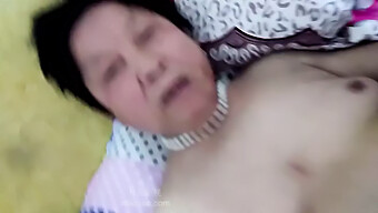 A Mature Asian Woman Engages In Sexual Activity