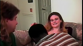 A Young Woman Gives Oral Pleasure To A Man While Being Penetrated By A Black Man In A Rough Manner.