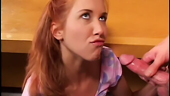 A Stunning Redhead College Student Gives Oral Sex To Her Teaching Assistant And Engages In Sexual Intercourse On A Desk In Their Dormitory, Resulting In A Facial Cumshot